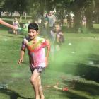 Goldfields pupil Gabe Zareh, 9, dashes through a cloud of dye at the colour run on Sunday. PHOTOS...