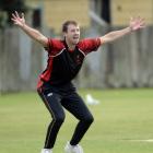 Albion fast bowler Tommy Clout successfully appeals for the wicket of University-Grange batter...