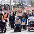 Members of Dunedin’s disabled community march down George St on Thursday. PHOTO: STEPHEN JAQUIERY