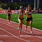 Becky Aitkenhead (4min 11.65sec) crosses the finish line ahead of Laura Nagel (4min 11.95sec) to...