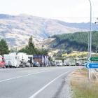 Vehicles backed up near Clyde await the reopening of State Highway 8 through the Cromwell Gorge....