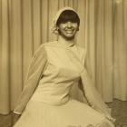 An unknown woman models garments from the Eden Hore Central Otago collection. The Eden Hore...