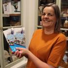 Gore Historical Museum curator Stephanie Herring holds a brochure which lists the activities...