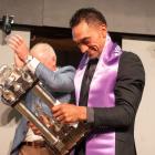 Southern shearer Leon Samuels collects the trophy after winning the recent Golden Shears open...