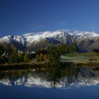 The Remarkables reflected in one of the ponds at Millbrook Golf Resort. Photo: Getty Images 
