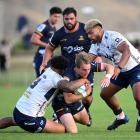 Cameron Millar has Highlanders team-mate Jermaine Ainsley in support as he charges at the Moana...