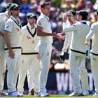 Australia's Josh Hazlewood (C) celebrates with teammates after dismissing New Zealand's Kane...