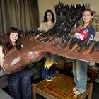 Dunedin sculptor Maleah Abbott-Newland (left) has created a life-size Haast eagle in her flat,...