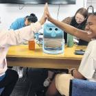Ellenber Ociones high fives Jade Waqairadovu at the learner licence theory testing event in...