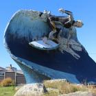 Colac Bay/Ōraka has been home to a giant surfer statue since 1999. In recent years, it has begun...