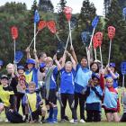Kaikorai Primary School pupils wave their lacrosse sticks during the Kaikorai Valley College...
