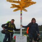 Linus Gilbert (left) and Robert Beck end their 36-day electric unicycle ride from Cape Reinga to...