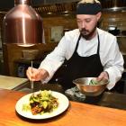 No 7 Balmac head chef Logan Wilson plates up. Photo: Gregor Richardson