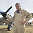 Pilot Steve Hinton, of the United States, stands in front of a newly restored Mosquito de...