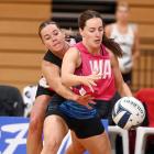 Steel wing attack Ella Southby holds her space for the ball against Tactix wing defence Greer...