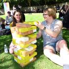 Nikki Scheib (left) and Dj King play a game of Jenga at Dunedin Pride’s Pride picnic at Woodhaugh...