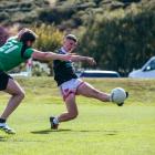 St Pat’s Emerald City Gaelic football player, Ger Sheehan, tries to shut down Adrian O’Dea, of...