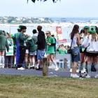 St Patrick’s day revelers take in the city vista from Brackens View. Photo: Peter McIntosh