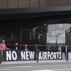 Sustainable Tarras members protest outside the Tourism Industry Aotearoa's national tourism...