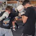 Getting in some light sparring are Ollie Berry, 17, (left) and Will Knight, 16, who will head off...