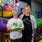 Alex Henderson, 8, checks out one of the toys alongside North Otago Toy Library president Sarah...