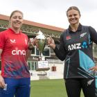 England captain Heather Knight (left) and White Ferns captain Suzie Bates with the trophy ahead...