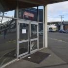 The front door of Zentech in Frederick St was damaged after a crash between two vehicles. PHOTO:...