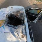 The damaged vehicle where employees from the World Central Kitchen (WCK) were killed in an...