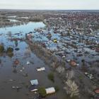 A drone view shows a flooded residential area in the settlement of Zarechnoye in Russia's...