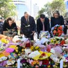 Australian Prime Minister Anthony Albanese lays flowers at the scene of the mass stabbing in...