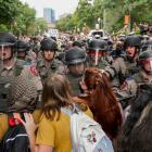 Texas State Troopers in riot gear break up protests at the University of Texas in Austin. Photo:...