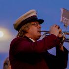 A bugler at the Oamaru dawn service is lit by the full moon this morning. Photo: Wyatt Ryder 