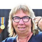 Cindy Kennedy with the medals awarded to her great-uncle. Photo: Peter McIntosh