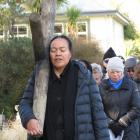 Mele Veituna, of Cromwell, carries a cross on Good Friday, during the Cromwell Combined Churches’...