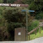 The old and decaying Bethunes Gully sign that used to arch over the entrance to Cluny St was...