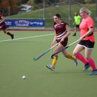 Mataura Riversdale player Rebecca Napier, (left) 15, and Pinkies wing Catherine Standish chase a...