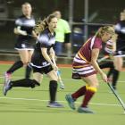 Mataura right inner Jess Titter dribbles the ball down the wing as Riversdale’s Megan Tree closes...