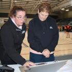 Netball Eastern Southland president Belinda Knapp (left) and draw convener Alison Cormack discuss...