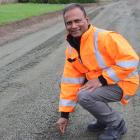 Gore District Council senior roading officer Hari Pillay checks the preparation of a shingle road...