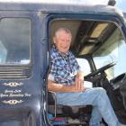 Gordy Leith of Tokanui sits behind the wheel of the Isuzu F series bulk sower which he has driven...