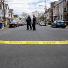 Residents and police gather outside of homes that were structurally damaged and had to be...