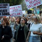 Demonstrators take part in a national rally against violence against women in the Sydney central...