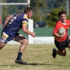 Halswell’s Iraia De Goldi looks to evade the tackle of Greymouth’s Harry Millar during their...