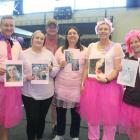 Holding pictures of loved ones who had cancer are, from left, Freddie Muller, Antonette Lexton,...