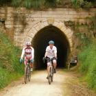 Cyclists emerge from a disused railway tunnel on the Alps 2 Ocean track. PHOTO: ODT FILES