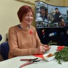 Volunteer Evelyn McDowall makes posies for Anzac Day, at HMNZS Toroa in Dunedin, yesterday. PHOTO...
