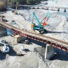 Work gets under way to repair a damaged rail bridge over the Rangitata River. A recently...