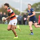 Zingari-Richmond centre, Tama Apineru, looks for an attacking opportunity against Dunedin at...