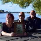 Showing a photo of their ancestor, chief Haimona Rakiraki Waitaha Kaitahu, are (from left) iwi...