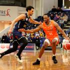 Southland Sharks’ Josh Turner (right) keeps Otago Nuggets’ Zaccheus Darko-Kelly at bay. PHOTOS:...
